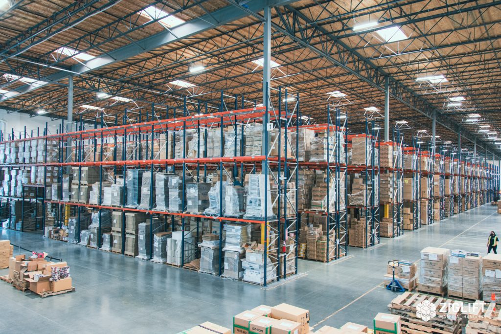 Professional installation team assembling pallet racking system